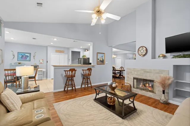 a kitchen that has a lot of cabinets in it and stainless steel appliances