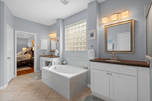 a bedroom with furniture and a window