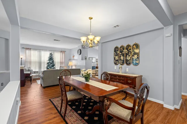 a living room with furniture a window and a fireplace