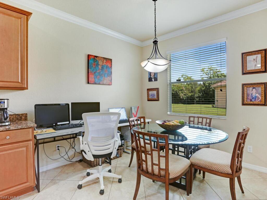 8143 Monticello Court Naples, FL 34104 - Photo 6 of 26 a view of a dining room with furniture window and outside view