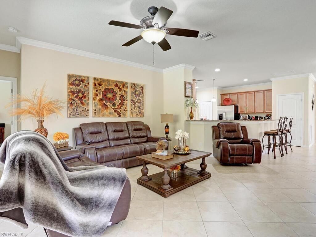 8143 Monticello Court Naples, FL 34104 - Photo 10 of 26 a living room with furniture