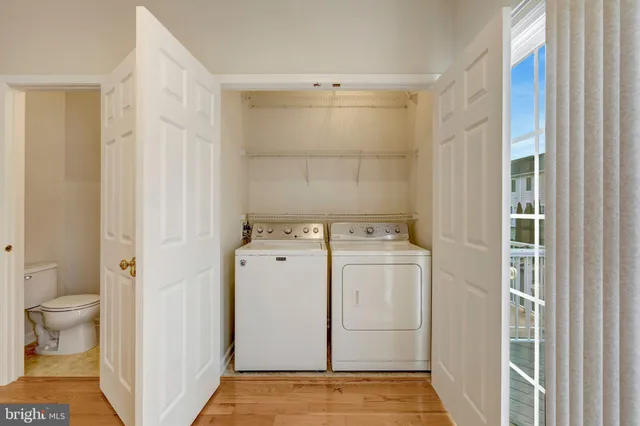 a view of bathroom with a washer and dryer