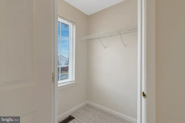 a view of a room that has a window in it