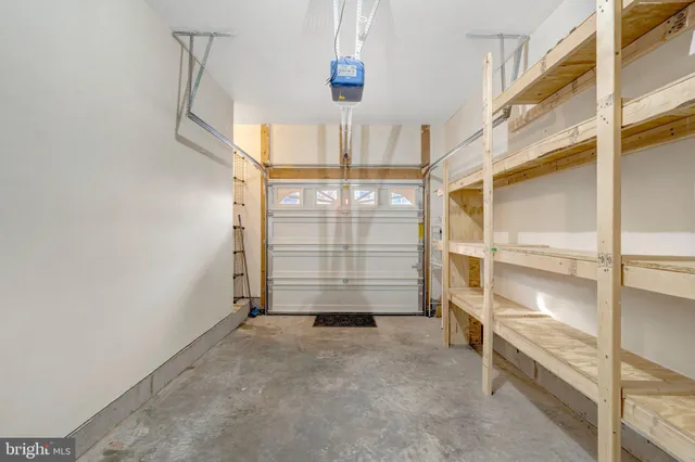 a front view of a house with garage