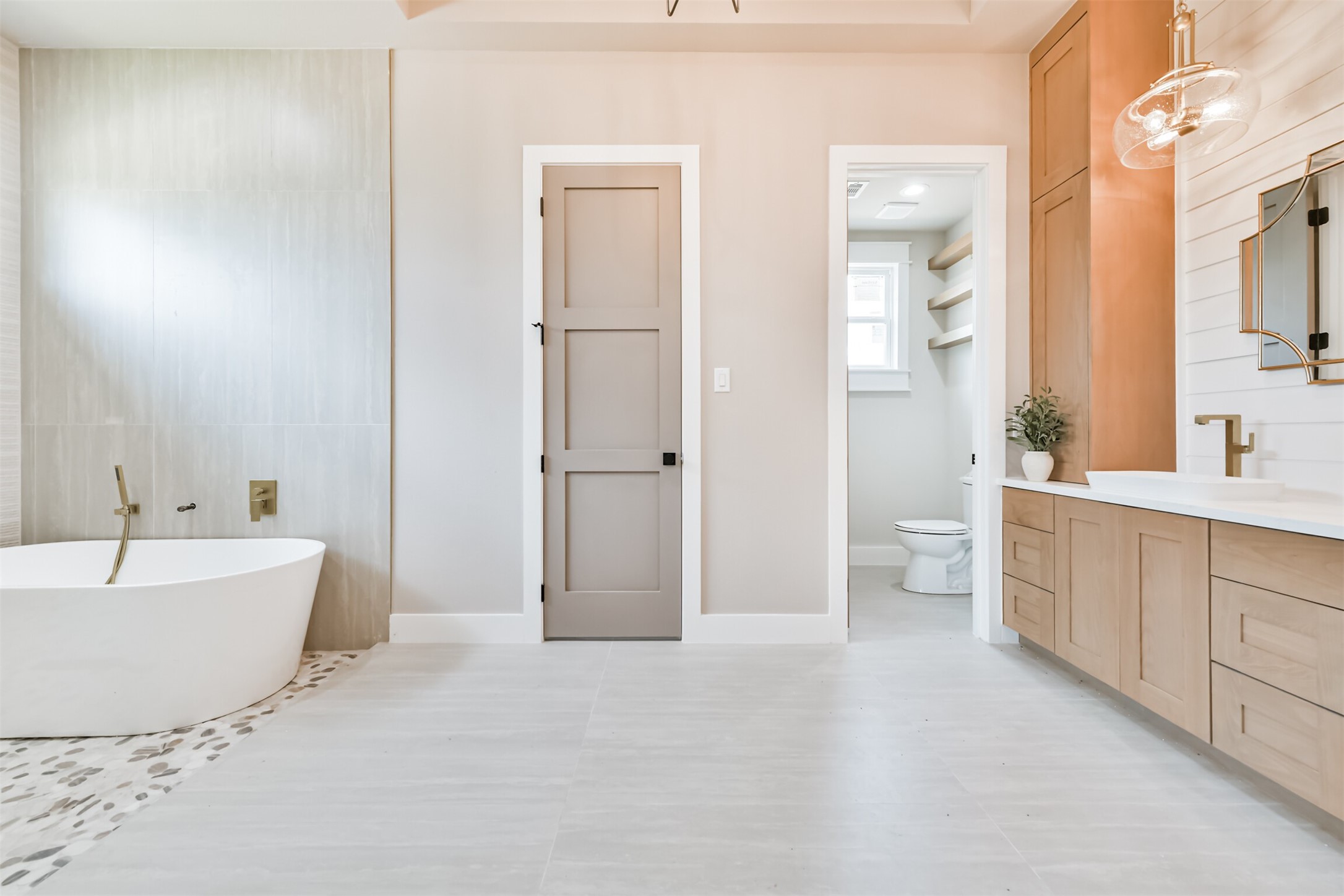 250 Pony Trail Angleton, TX 77515 - Photo 13 of 32 Luxurious spa-inspired master bathroom featuring elegant fixtures and a serene ambiance.