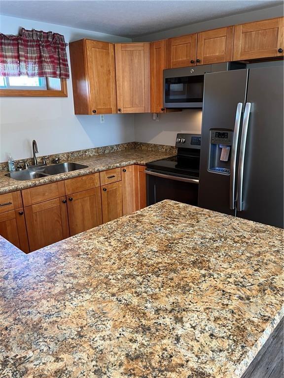 8018 De Villars Road Cochranton, PA 16314 - Photo 7 of 25 a kitchen with stainless steel appliances kitchen island granite countertop a refrigerator and a sink