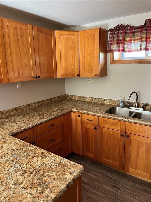 8018 De Villars Road Cochranton, PA 16314 - Photo 8 of 25 a kitchen with granite countertop wooden cabinets a sink and dishwasher
