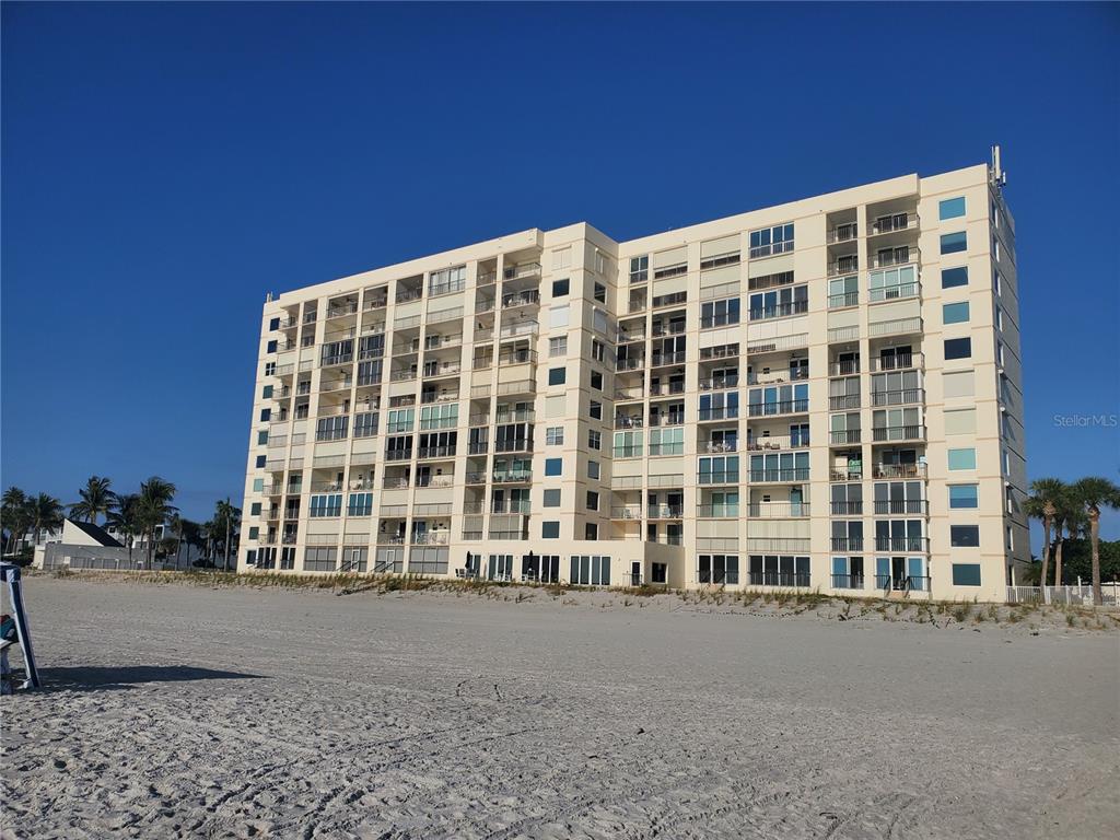 4401 Gulf Of Mexico Drive, Unit 703 Longboat Key, FL 34228 - Photo 1 of 23 front view of building with a street