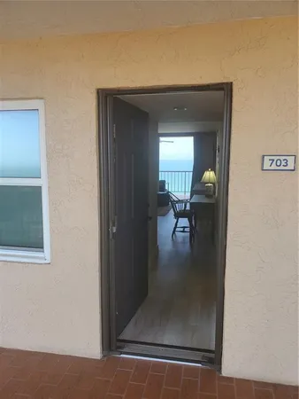 a view of a livingroom and a dining room with a couch