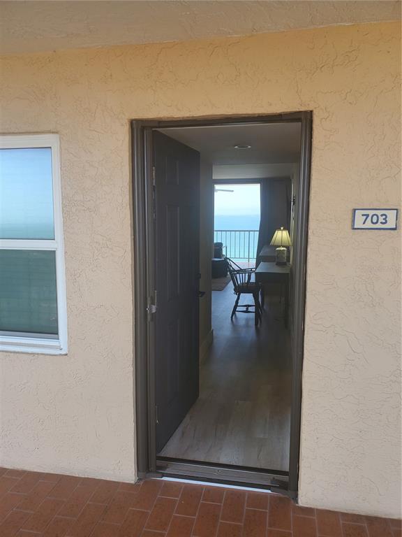 4401 Gulf Of Mexico Drive, Unit 703 Longboat Key, FL 34228 - Photo 2 of 23 a view of a livingroom and a dining room with a couch