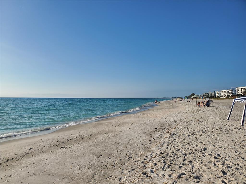 4401 Gulf Of Mexico Drive, Unit 703 Longboat Key, FL 34228 - Photo 23 of 23 a view of a beach and ocean view