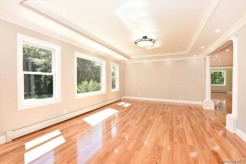 87 Dunlop Road Huntington, NY 11743 - Photo 5 of 31 a view of an empty room with a window