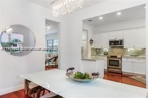 a kitchen with a sink stove and microwave