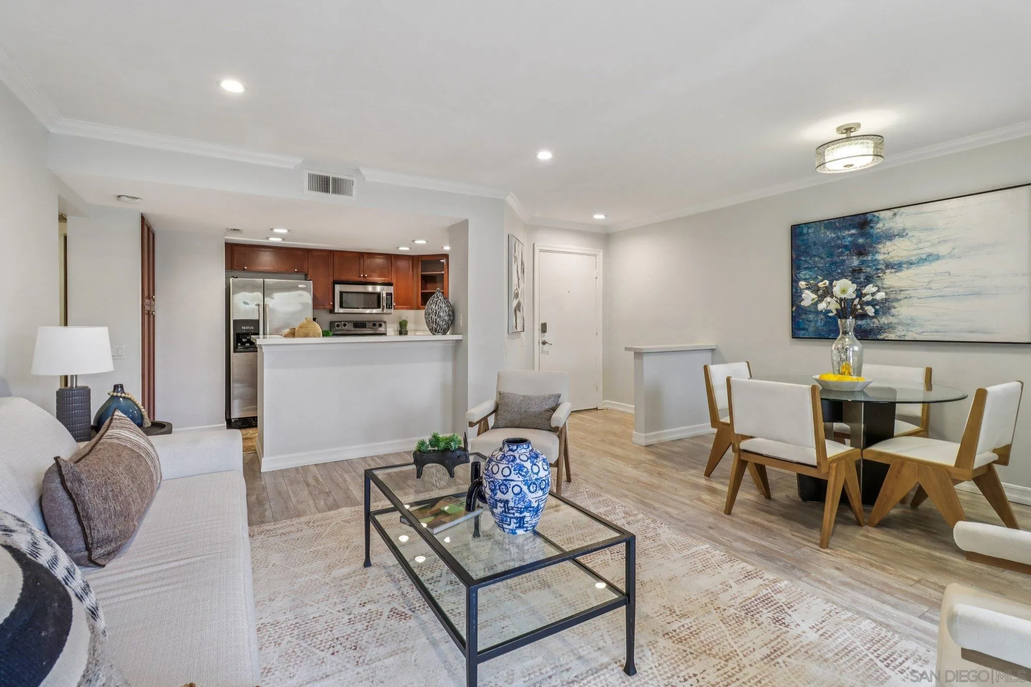 15373 Maturin Drive, Unit 178 San Diego, CA 92127 - Photo 3 of 61 a living room with furniture a rug and white walls