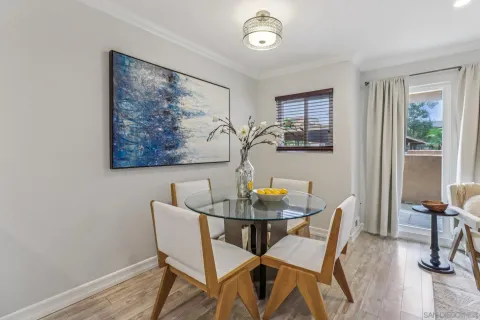 a view of a dining room with furniture and a window
