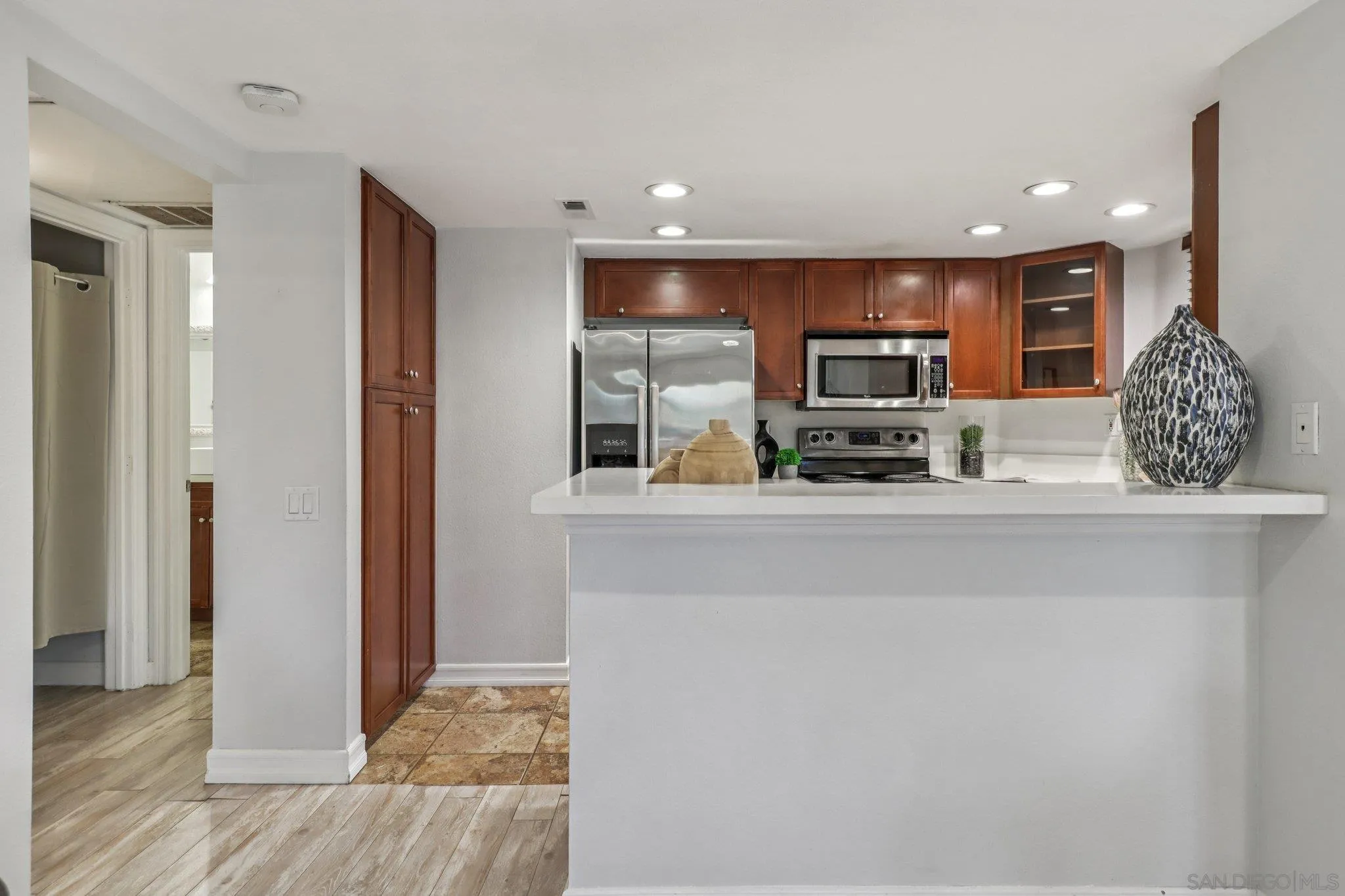 15373 Maturin Drive, Unit 178 San Diego, CA 92127 - Photo 10 of 61 a kitchen with stainless steel appliances granite countertop a refrigerator and a sink