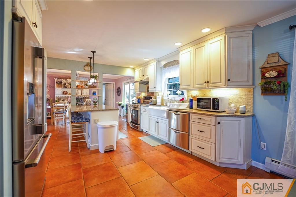 36 Starkin Road Edison, NJ 08837 - Photo 11 of 45 a kitchen with a sink and cabinets