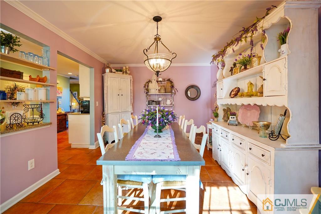 36 Starkin Road Edison, NJ 08837 - Photo 15 of 45 a view of living room with furniture and a chandelier