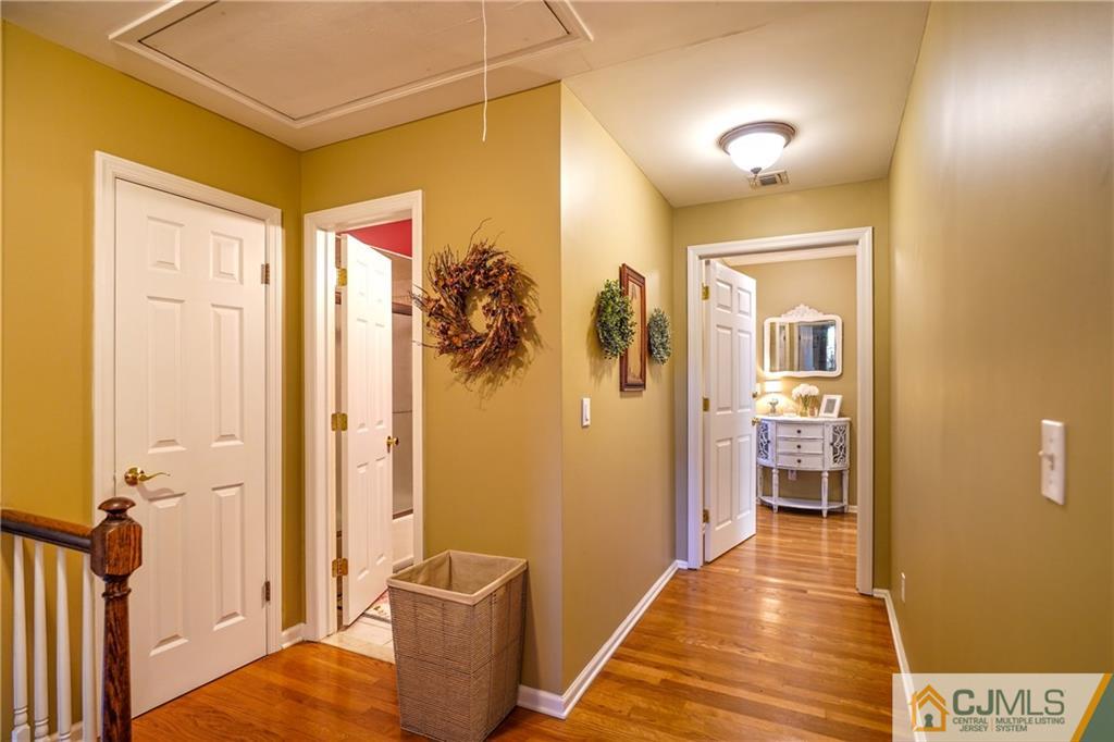 36 Starkin Road Edison, NJ 08837 - Photo 20 of 45 a hallway with wooden floor and closet