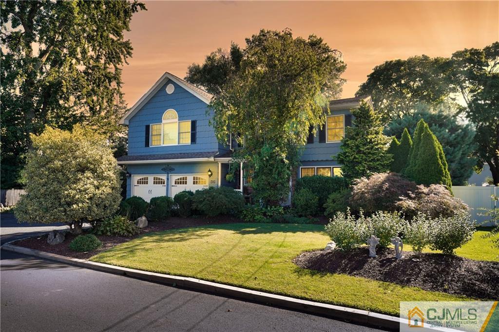 36 Starkin Road Edison, NJ 08837 - Photo 2 of 45 a front view of a house with a yard and garage