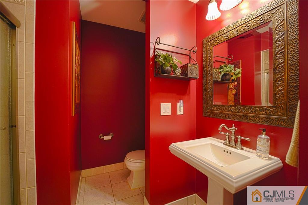 36 Starkin Road Edison, NJ 08837 - Photo 21 of 45 a bathroom with a sink and a mirror