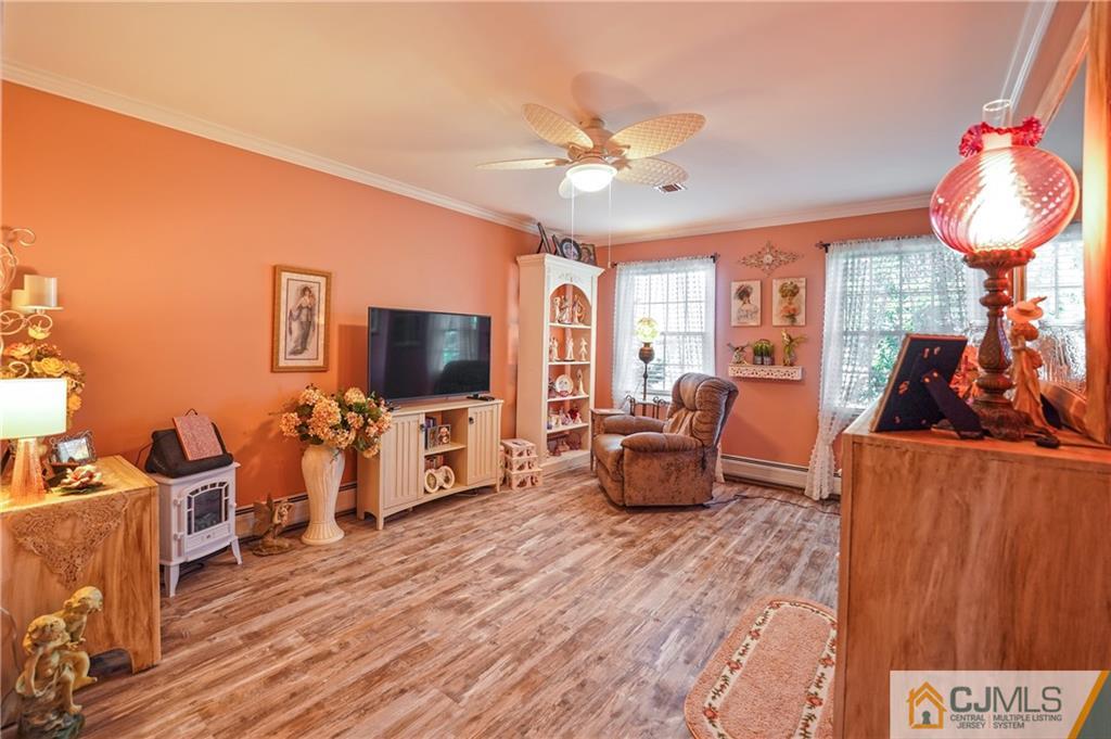 36 Starkin Road Edison, NJ 08837 - Photo 22 of 45 a living room with furniture and a flat screen tv