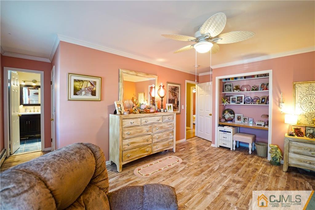 36 Starkin Road Edison, NJ 08837 - Photo 23 of 45 a bedroom with a bed and a chandelier