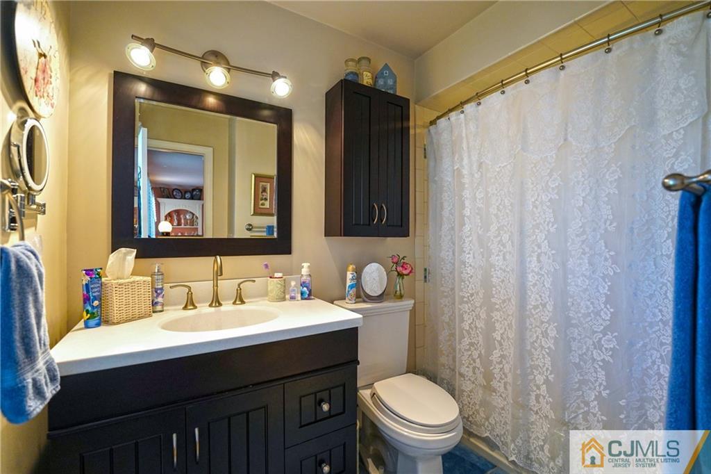 36 Starkin Road Edison, NJ 08837 - Photo 24 of 45 a bathroom with a sink vanity mirror and toilet