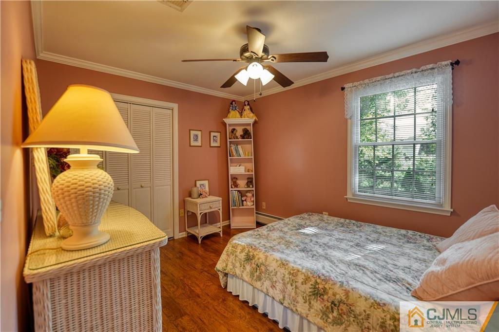 36 Starkin Road Edison, NJ 08837 - Photo 26 of 45 a bedroom with a bed and wooden floor