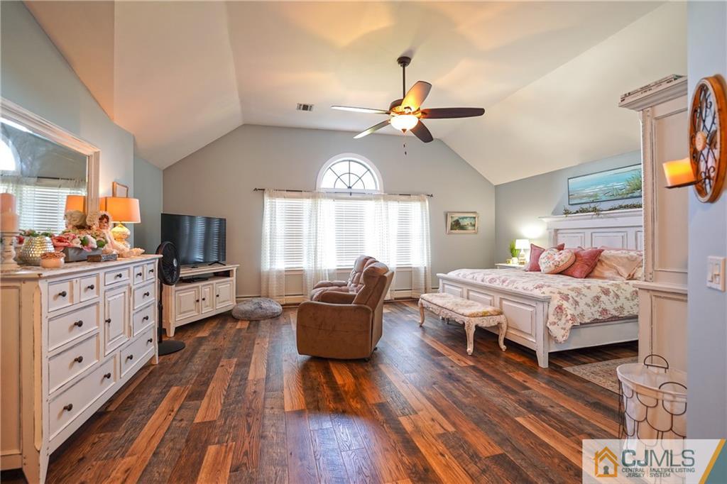 36 Starkin Road Edison, NJ 08837 - Photo 28 of 45 a bedroom with a bed and wooden floor