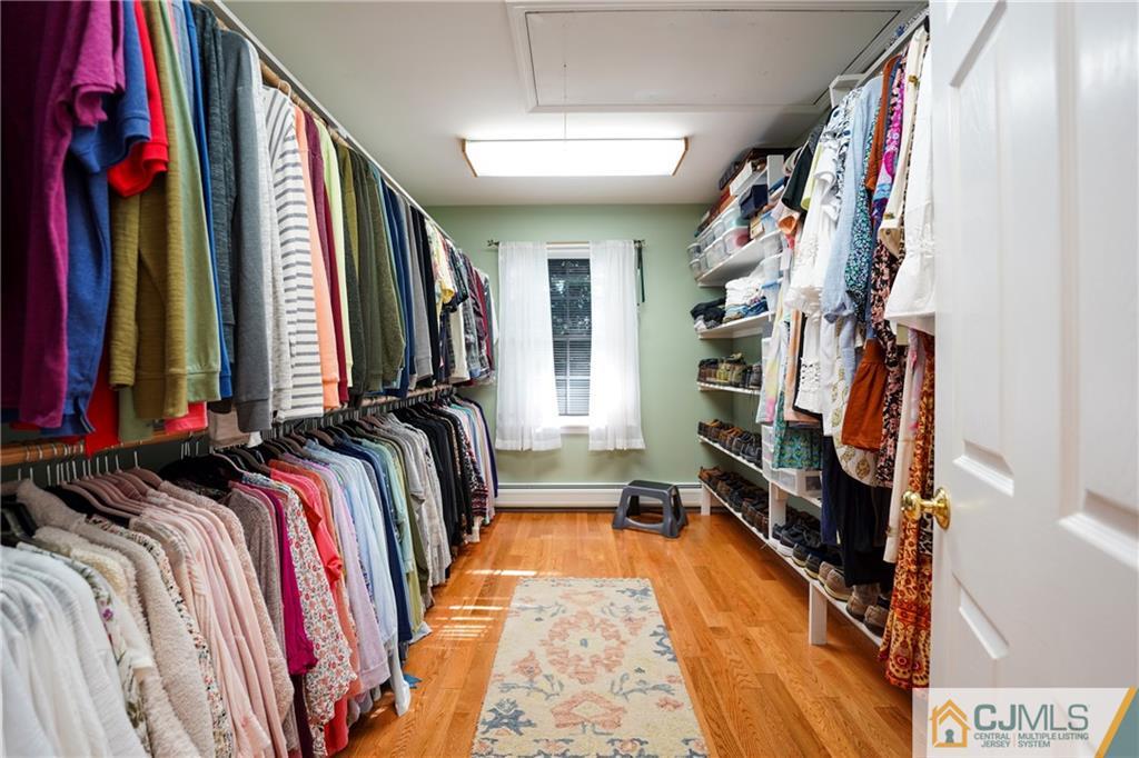 36 Starkin Road Edison, NJ 08837 - Photo 33 of 45 a view of walk in closet with clothes and shoes