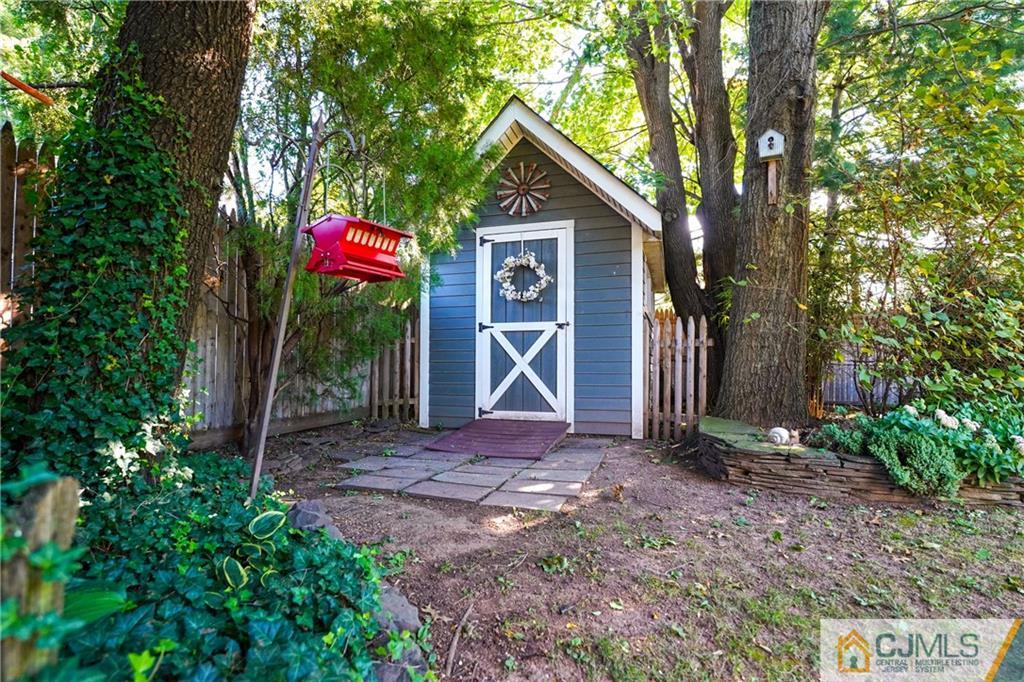 36 Starkin Road Edison, NJ 08837 - Photo 44 of 45 a view of a house with backyard and trees