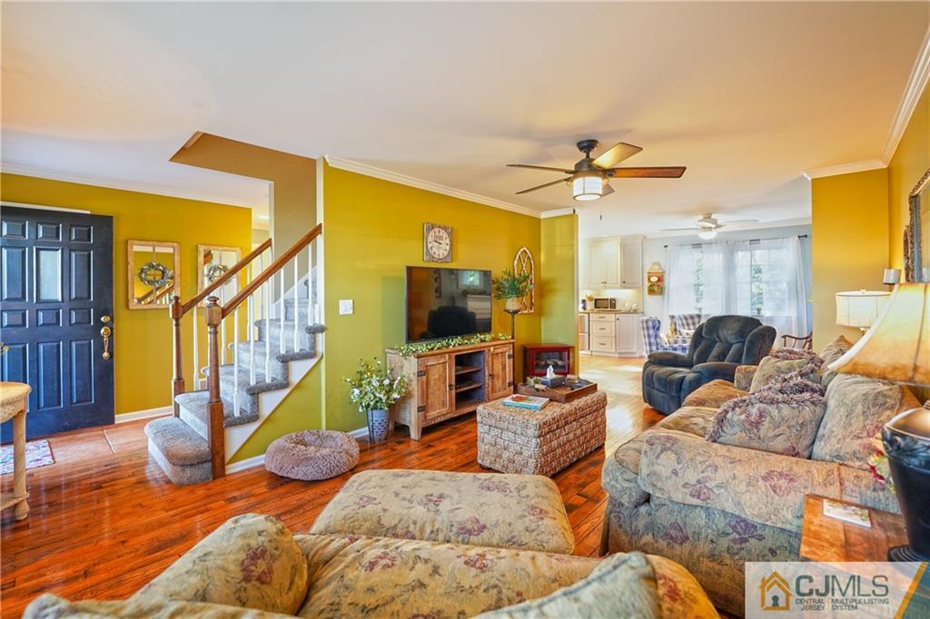 36 Starkin Road Edison, NJ 08837 - Photo 6 of 45 a living room with furniture and a flat screen tv