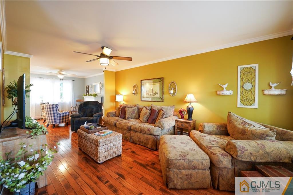 36 Starkin Road Edison, NJ 08837 - Photo 7 of 45 a living room with furniture and a chandelier
