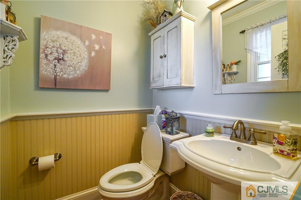 36 Starkin Road Edison, NJ 08837 - Photo 9 of 45 a bathroom with a sink mirror and toilet
