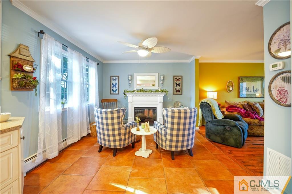 36 Starkin Road Edison, NJ 08837 - Photo 10 of 45 a living room with furniture a fireplace and a flat screen tv