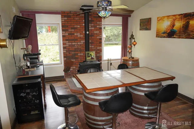 a room with furniture a flat screen tv and a window