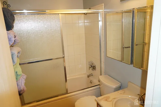 a bathroom with a shower and a toilet