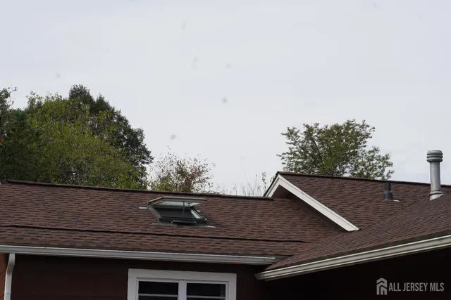 a view of roof and tree