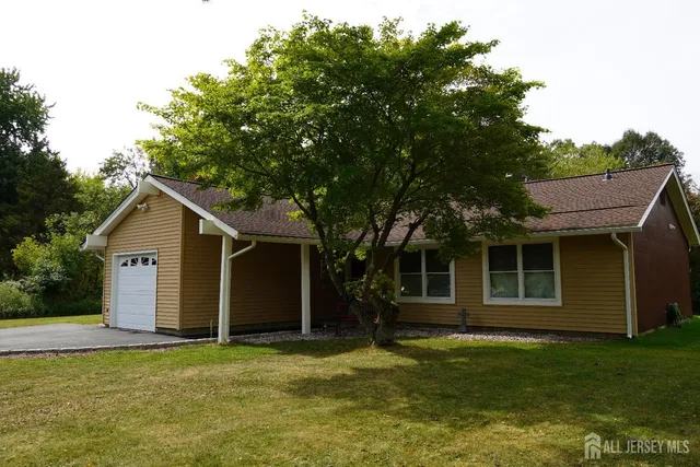 a house with a tree in front of it
