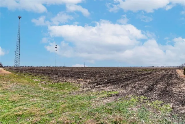 a view of a swimming pool with an outdoor space and seating area