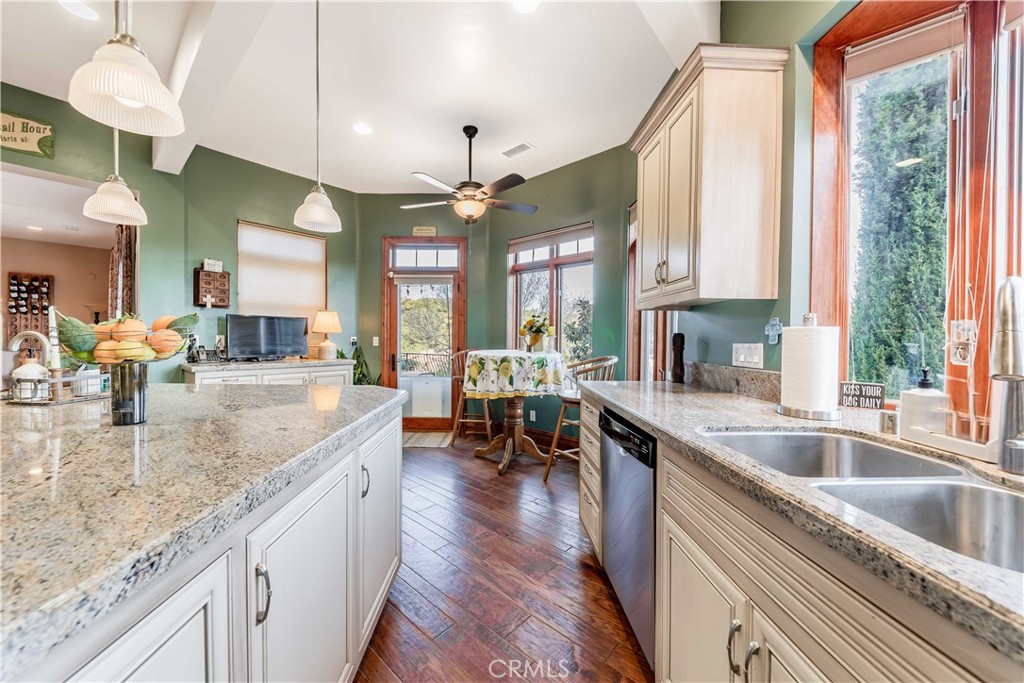 26525 Carancho Road Temecula, CA 92590 - Photo 18 of 64 a kitchen with stainless steel appliances granite countertop sink stove and cabinets