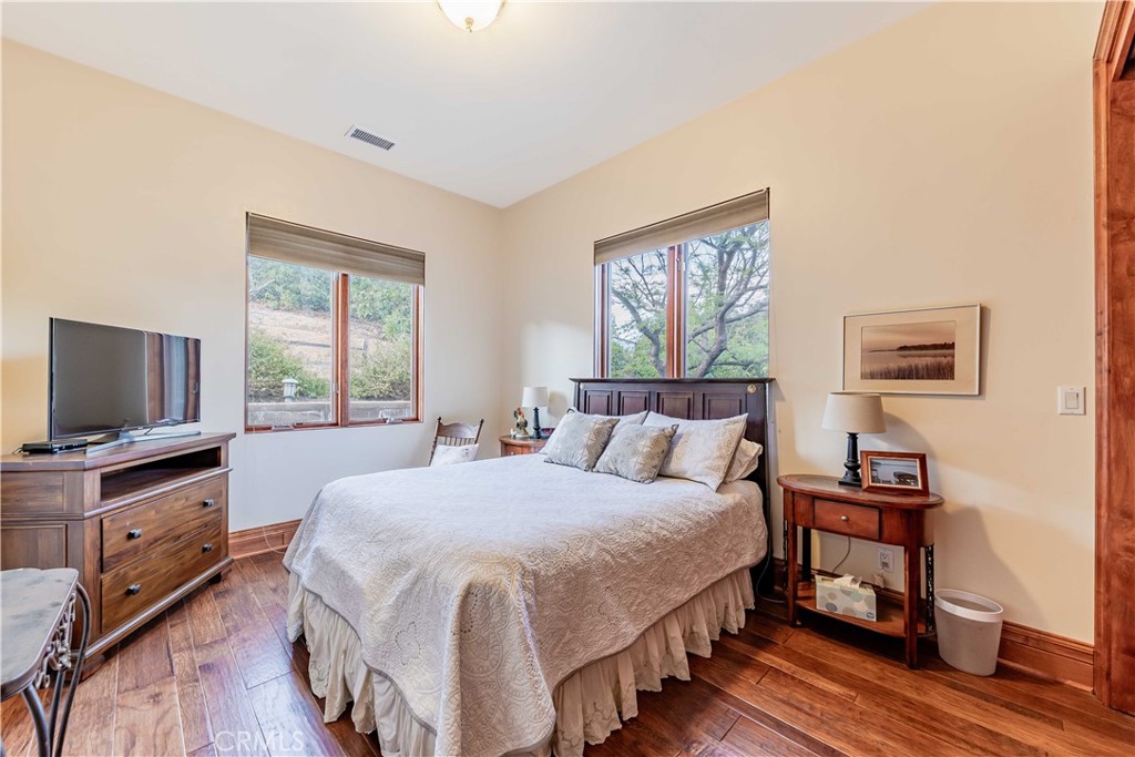 26525 Carancho Road Temecula, CA 92590 - Photo 30 of 64 a bedroom with a bed and a flat screen tv