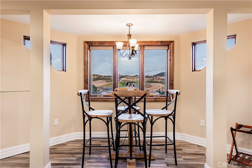 26525 Carancho Road Temecula, CA 92590 - Photo 38 of 64 a view of a dining room with furniture and window