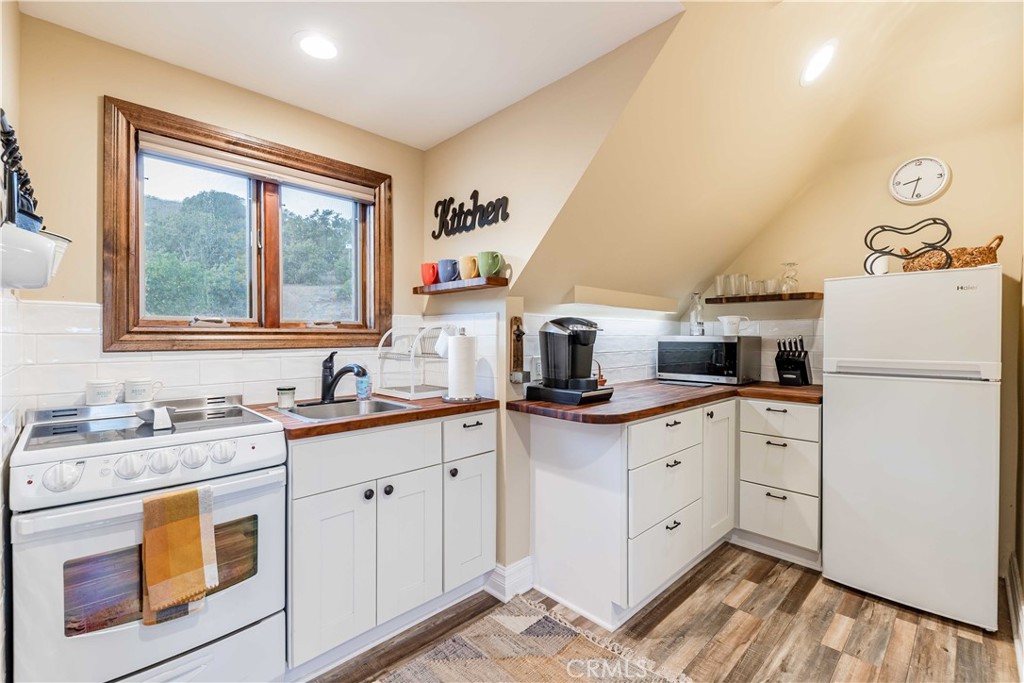 26525 Carancho Road Temecula, CA 92590 - Photo 39 of 64 a kitchen with appliances a sink and a window