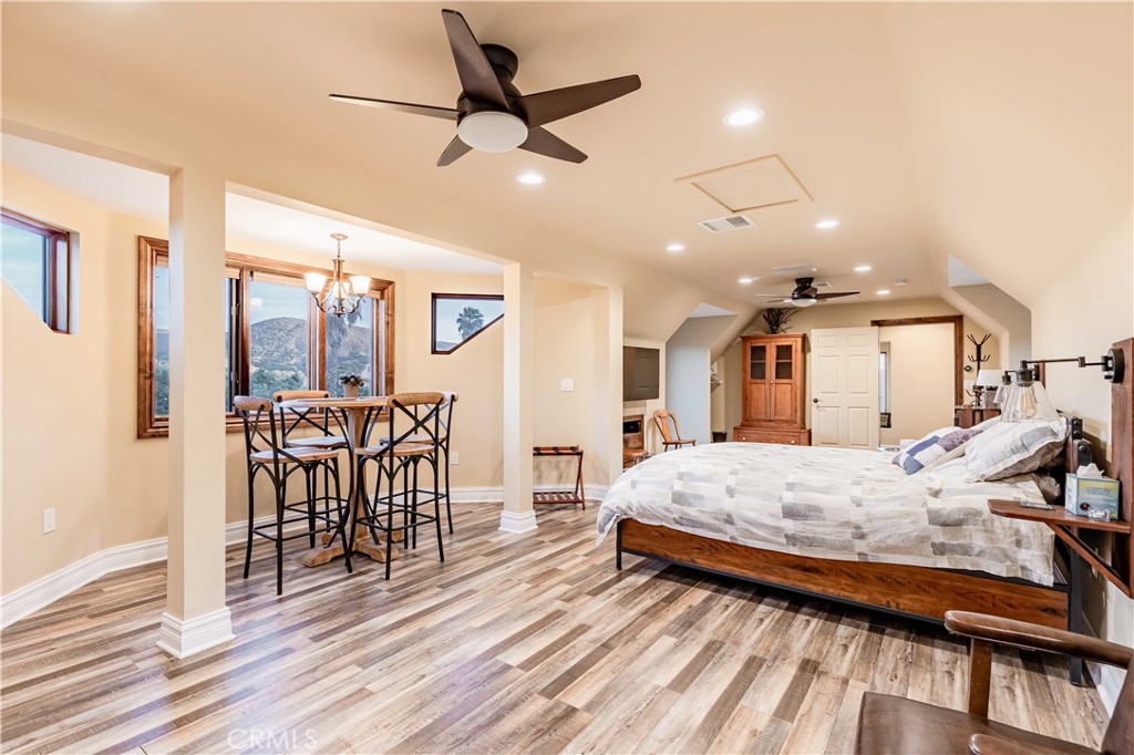 26525 Carancho Road Temecula, CA 92590 - Photo 41 of 64 a bedroom with furniture and a wooden floor