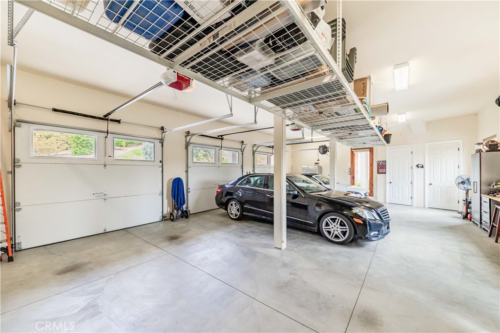 26525 Carancho Road Temecula, CA 92590 - Photo 44 of 64 a car parked in garage