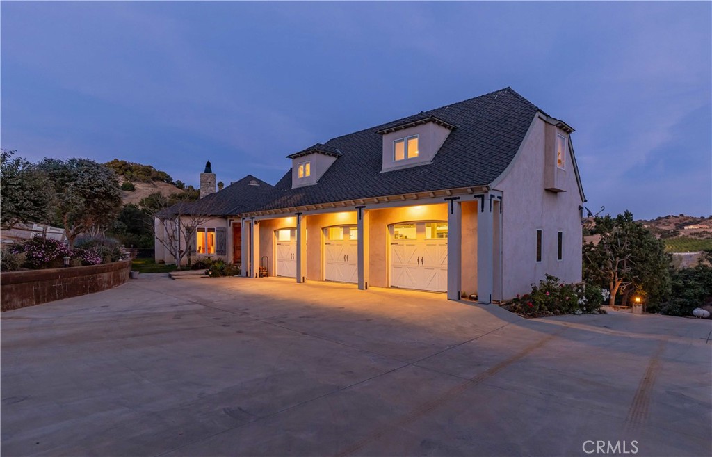 26525 Carancho Road Temecula, CA 92590 - Photo 54 of 64 a front view of a house with a yard