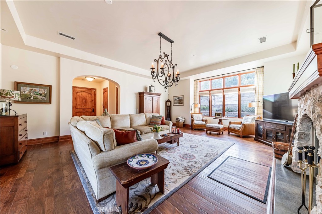 26525 Carancho Road Temecula, CA 92590 - Photo 8 of 64 a living room with furniture fireplace and a large window
