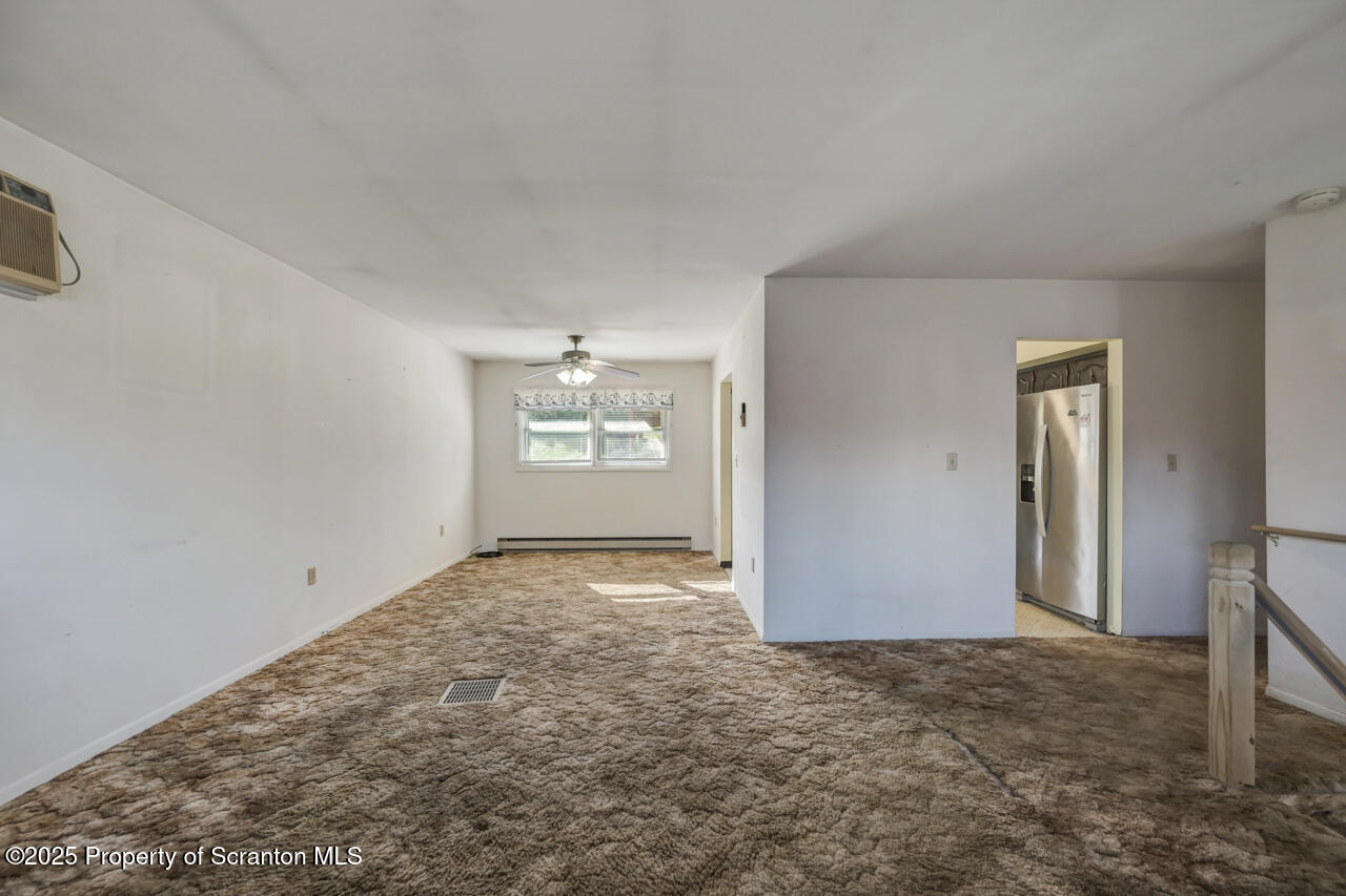 446 Maple Grove Road Moscow, PA 18444 - Photo 13 of 51 an empty room with windows